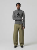 DAXUEN Fitted long-sleeved turtleneck top with star graphic — model photo