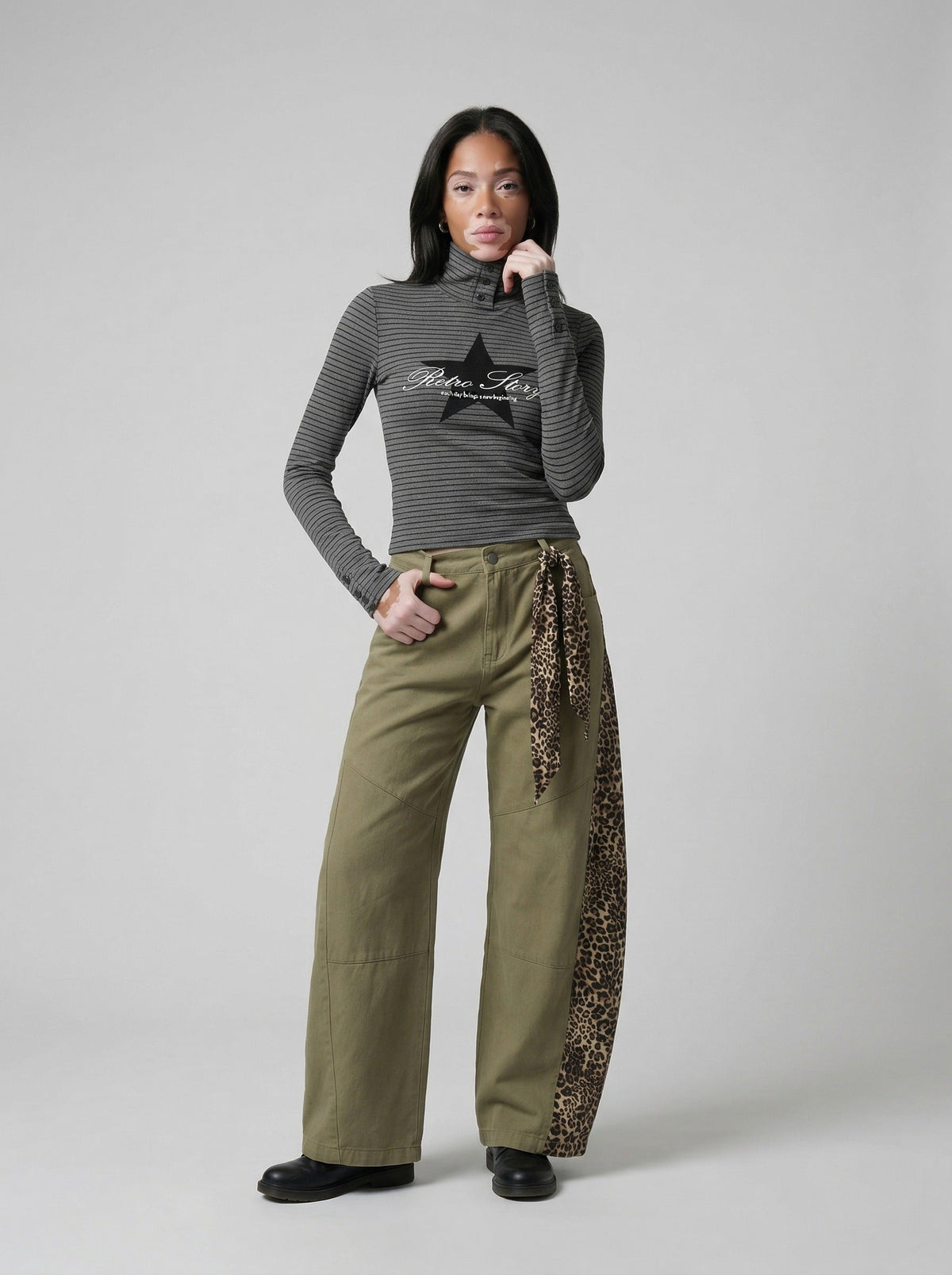 DAXUEN Fitted long-sleeved turtleneck top with star graphic — model photo