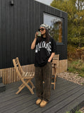 DAXUEN Graphic T-Shirt with retro street style design — model photo