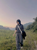 DAXUEN Loose-fitting striped Henley T-shirt — model photo