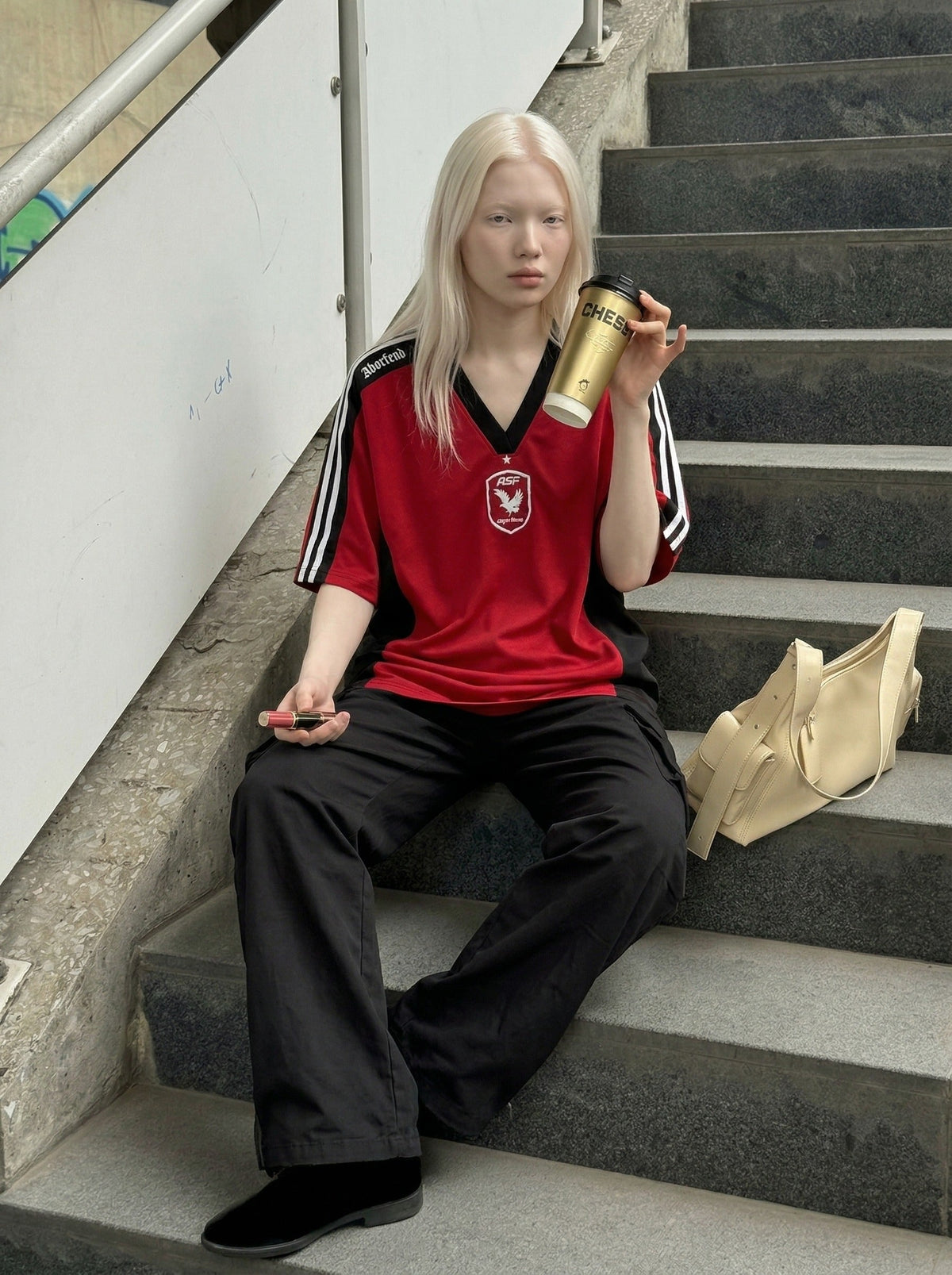 DAXUEN Oversized V-neck T-shirt with contrasting panels and graphics — model photo