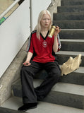 DAXUEN Oversized V-neck T-shirt with contrasting panels and graphics — model photo