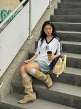DAXUEN Oversized V-neck T-shirt with contrasting panels and graphics — model photo