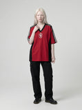 DAXUEN Oversized V-neck T-shirt with contrasting panels and graphics — model photo
