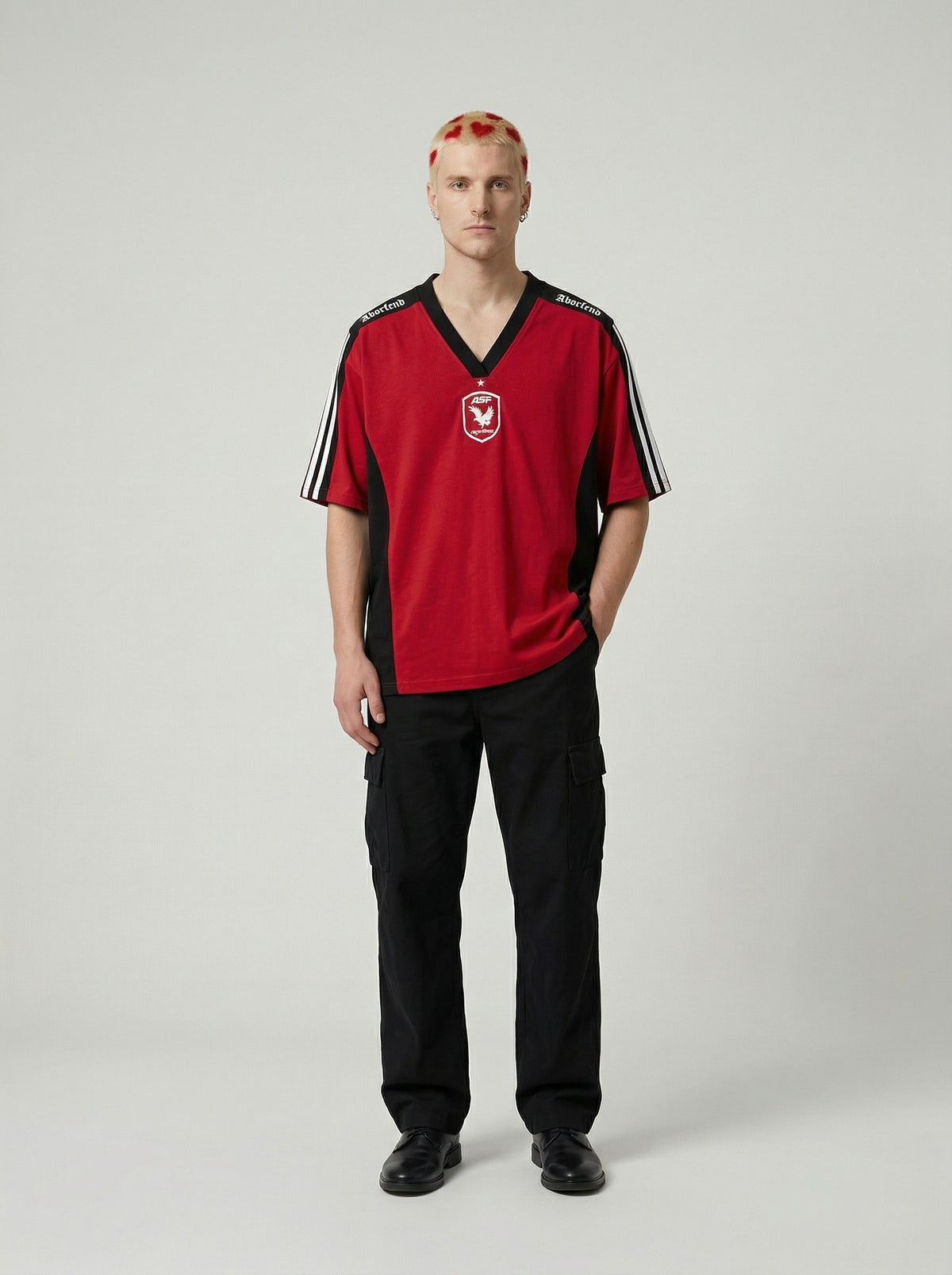 DAXUEN Oversized V-neck T-shirt with contrasting panels and graphics — model photo