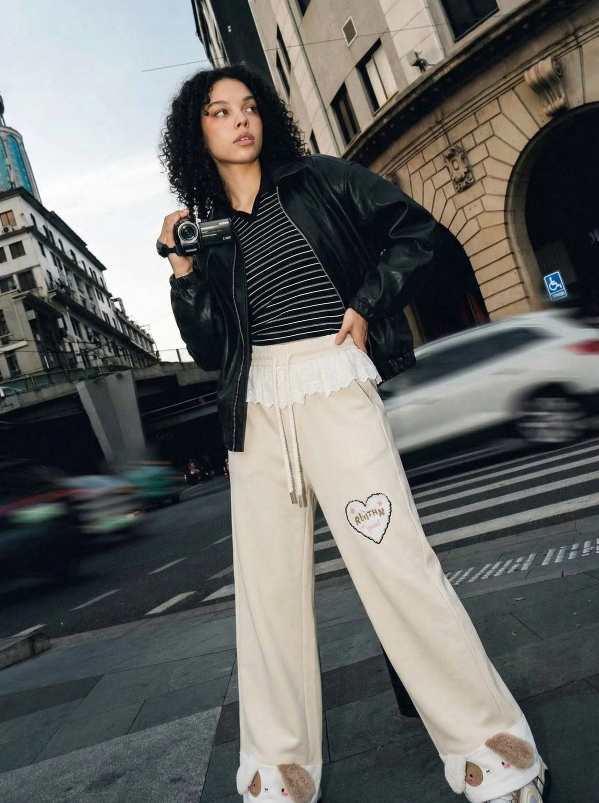 DAXUEN Wide-leg sweatpants with dog face appliqués — model photo