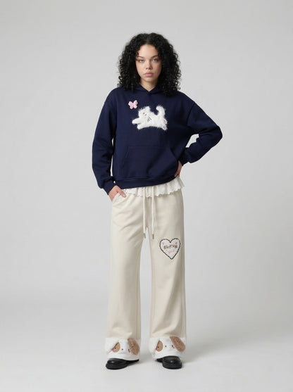 DAXUEN Wide-leg sweatpants with dog face appliqués — model photo
