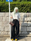 DAXUEN Oversized Graffiti Script Tee — model photo