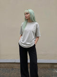 DAXUEN Oversized Graffiti Script Tee — model photo