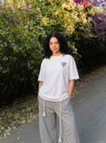 DAXUEN Oversized Graffiti Script Tee — model photo
