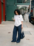 DAXUEN Oversized Graffiti Script Tee — model photo