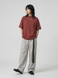 DAXUEN rust oversized mock neck graphic tee — model photo