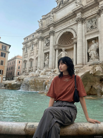 DAXUEN rust oversized mock neck graphic tee — model photo