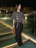 DAXUEN Graphic V-neck t-shirt with embroidered designs — model photo