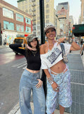 DAXUEN Light blue denim wide-leg jeans with graphic prints — model photo
