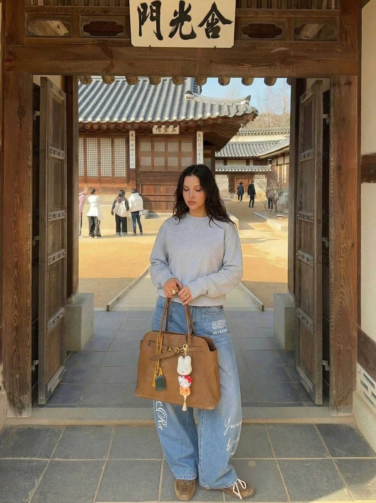 DAXUEN Light blue denim wide-leg jeans with graphic prints — model photo