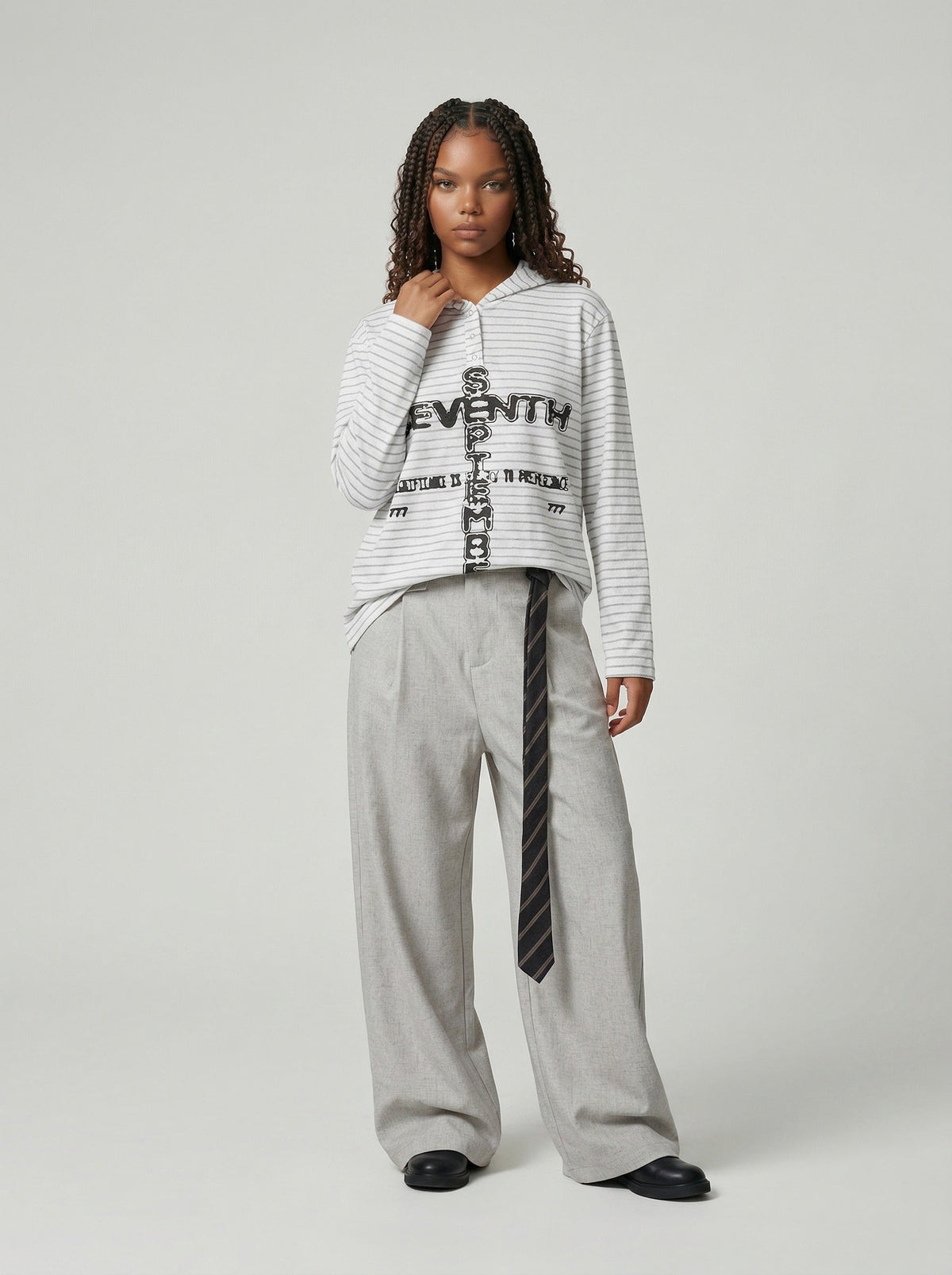 DAXUEN Striped hooded top with graphic print — model photo