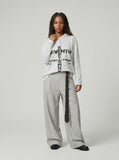 DAXUEN Striped hooded top with graphic print — model photo