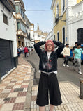 DAXUEN Black wide-leg culotte shorts — model photo