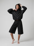 DAXUEN Black wide-leg culotte shorts — model photo