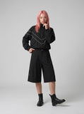 DAXUEN Black wide-leg culotte shorts — model photo