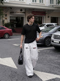 DAXUEN black sheer knit crew neck t-shirt — model photo