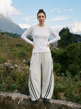 DAXUEN black sheer textured long-sleeve knit tee — model photo