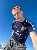 DAXUEN navy blue shield crest contrast stripe athletic tee — model photo