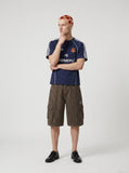 DAXUEN navy blue shield crest contrast stripe athletic tee — model photo