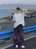 DAXUEN Oversized mock neck top with speckled texture — model photo