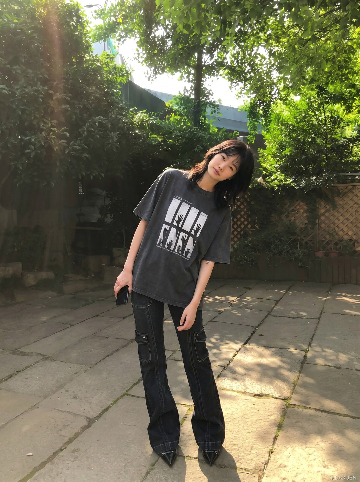 DAXUEN dark charcoal oversized silhouetted-hands graphic tee — model photo
