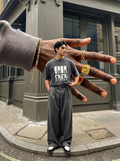 DAXUEN dark charcoal oversized silhouetted-hands graphic tee — model photo