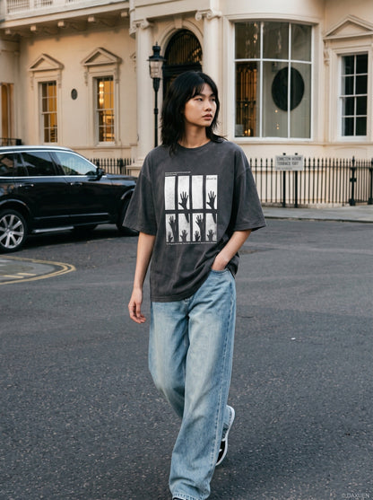 DAXUEN dark charcoal oversized silhouetted-hands graphic tee — model photo