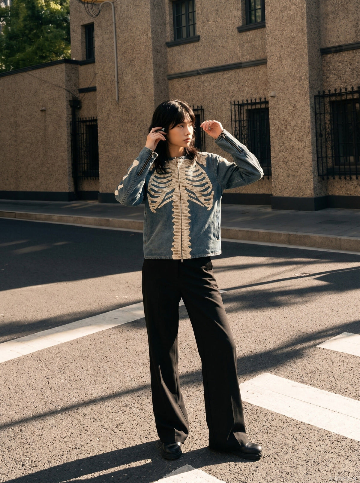 DAXUEN Crew neck denim jacket with skeletal design — model photo