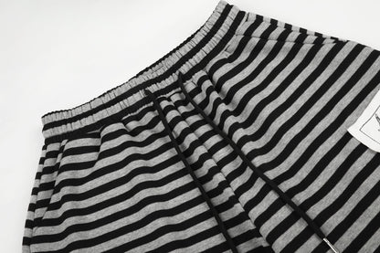 DAXUEN striped wide-leg pants with skull and structure patches