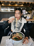 DAXUEN white cropped biker jacket with skull graphic — model photo