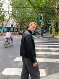 DAXUEN black leather-look jacket with zippered details — model photo