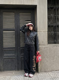 DAXUEN black leather-look jacket with zippered details — model photo