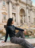 DAXUEN black leather-look jacket with zippered details — model photo