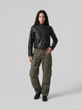 DAXUEN black leather-look jacket with zippered details — model photo