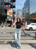 DAXUEN black mock neck buttoned top — model photo
