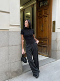 DAXUEN black mock neck buttoned top — model photo