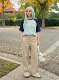 DAXUEN olive green wide-leg cargo pants with flap pockets — model photo