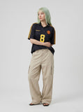 DAXUEN olive green wide-leg cargo pants with flap pockets — model photo