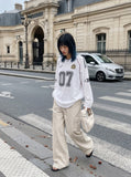 DAXUEN olive green wide-leg cargo pants with flap pockets — model photo