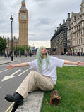 DAXUEN olive green wide-leg cargo pants with flap pockets — model photo
