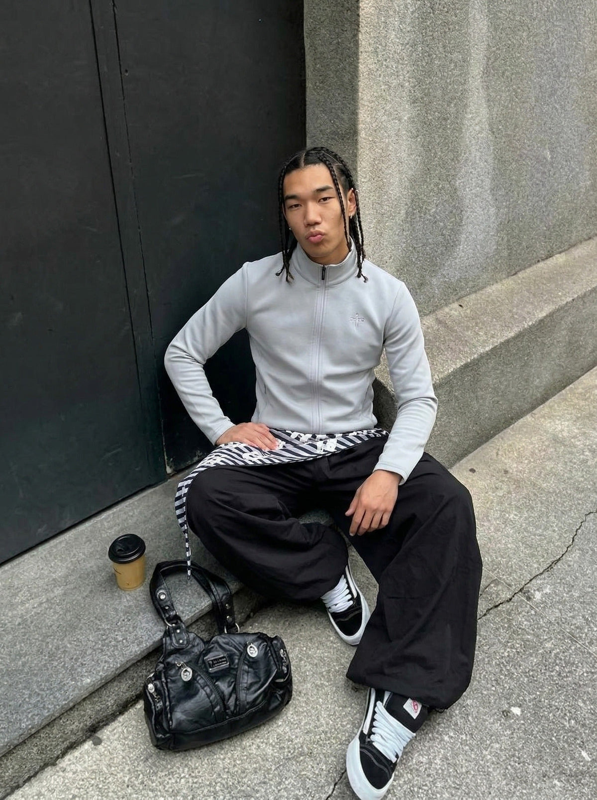 DAXUEN Sleek zip-up athletic jacket with embroidered logo — model photo