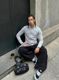 DAXUEN Sleek zip-up athletic jacket with embroidered logo — model photo