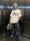 DAXUEN white oversized smoke graphic tee — model photo
