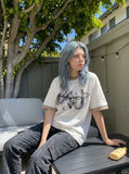 DAXUEN white oversized smoke graphic tee — model photo